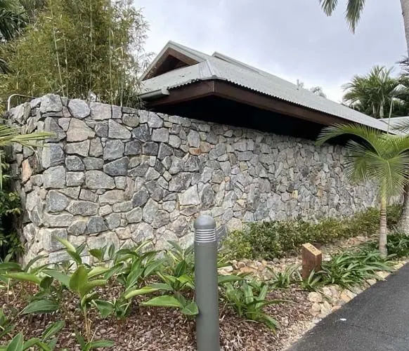 Natural stone retaining wall by All Stone & Pave